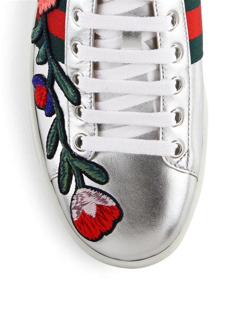 gucci metallic flowers sneakers|Gucci ace floral embroidered sneakers.